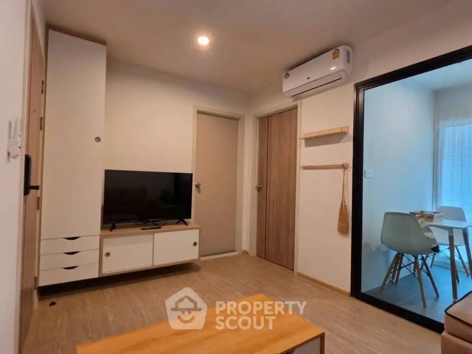 Modern living room with air conditioning and stylish furniture in a cozy apartment.