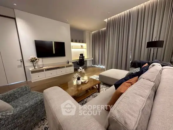 Luxurious modern living room with elegant decor and cozy seating area.