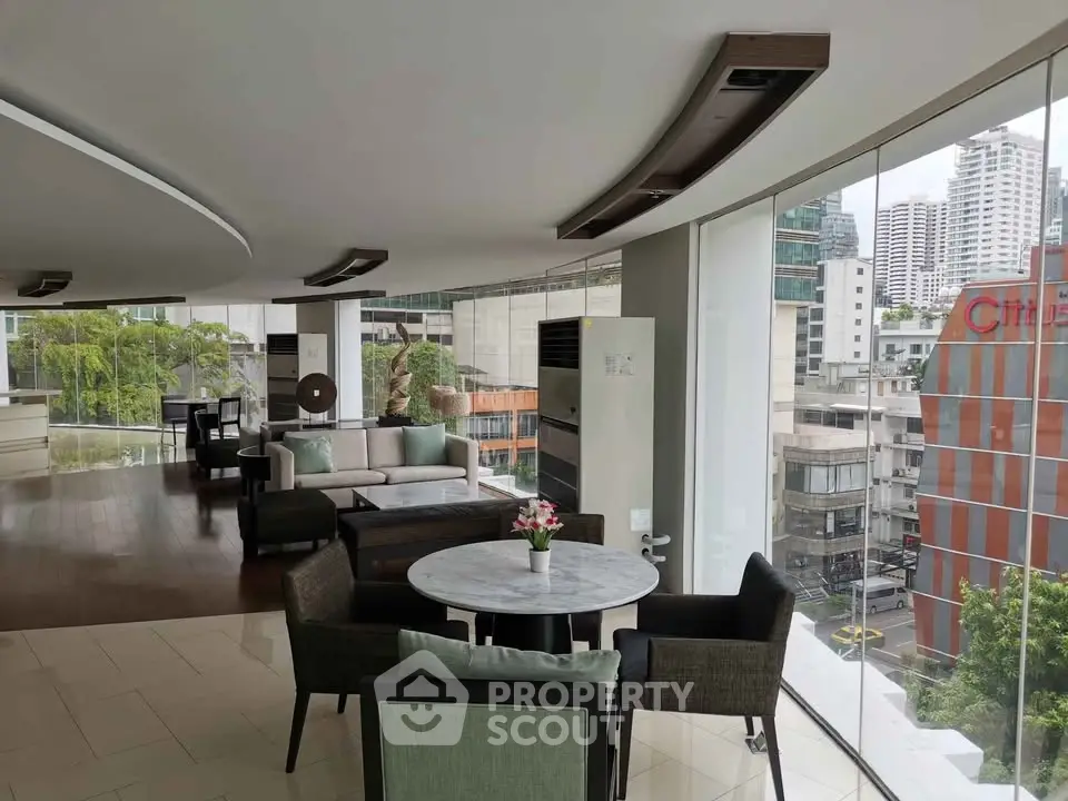 Modern living room with panoramic city view and stylish furniture