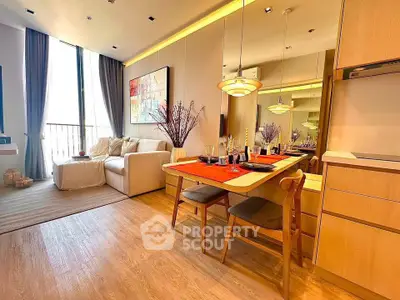 Stylish open-plan living and dining area with modern decor and natural light.