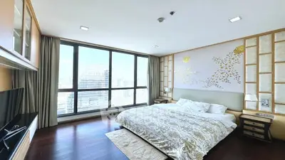 Luxurious bedroom with stunning city view and elegant decor