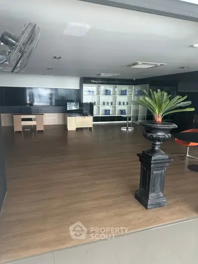 Spacious modern office lobby with wooden flooring and stylish decor