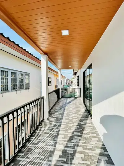 Spacious balcony with modern design and elegant railing, perfect for relaxation and enjoying the view.
