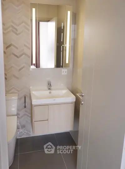 Modern bathroom with sleek vanity and stylish tile design