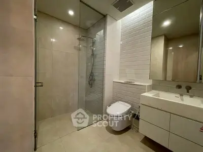 Modern bathroom with glass shower and sleek fixtures
