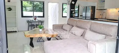 Modern living room with plush sofa and unique wooden coffee table