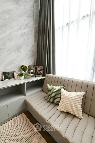 Stylish modern living room with elegant decor and cozy seating area.