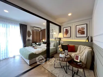 Modern bedroom with stylish decor and cozy seating area