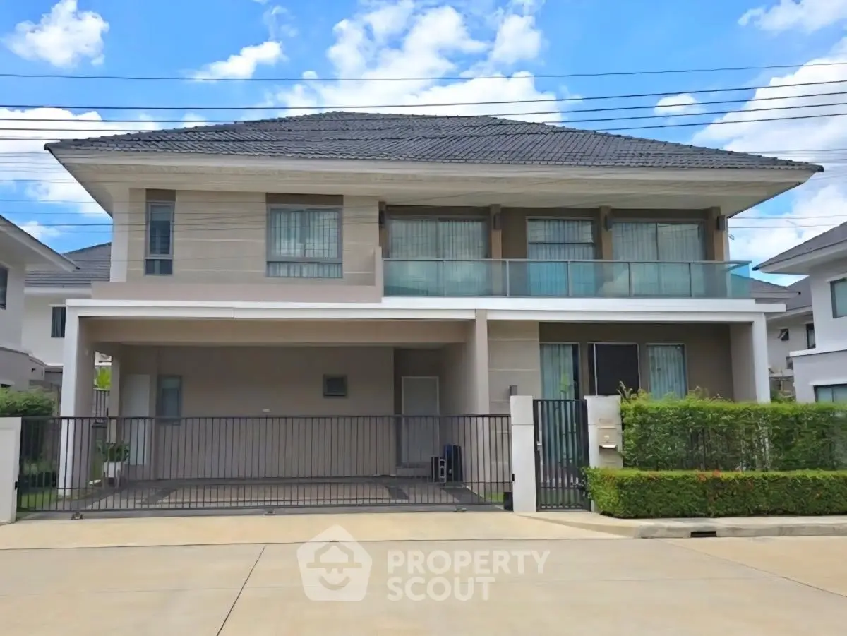 Stunning modern two-story house with spacious driveway and lush greenery, perfect for family living.