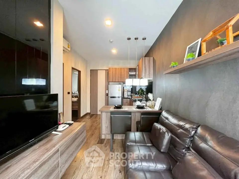 Modern living room with sleek kitchen and stylish decor