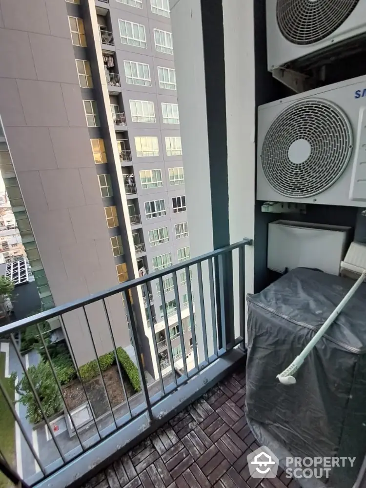 Urban balcony with air conditioning units and city view