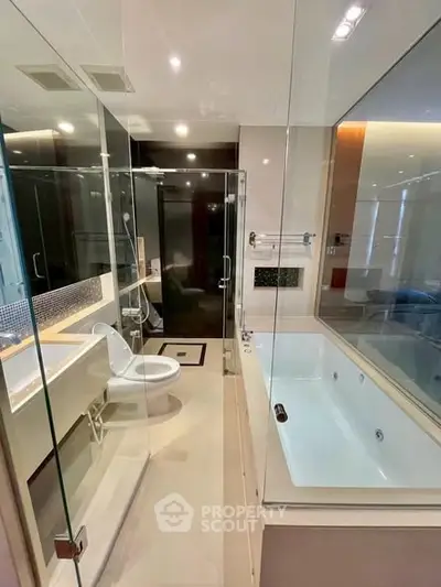 Luxurious modern bathroom with glass shower and bathtub