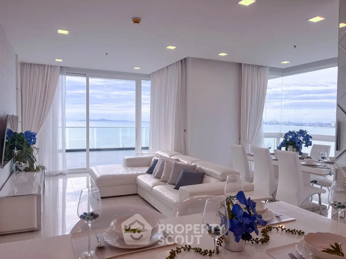 Luxurious living room with stunning ocean view and elegant white decor