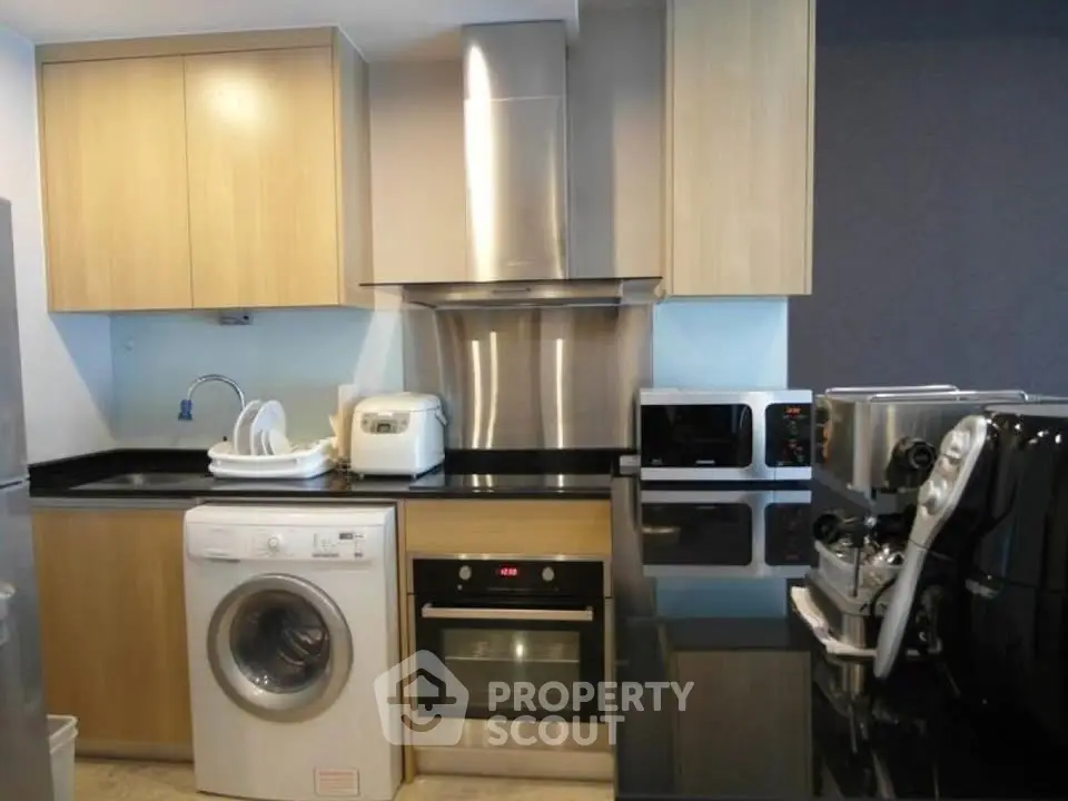 Modern kitchen with sleek appliances and closed layout