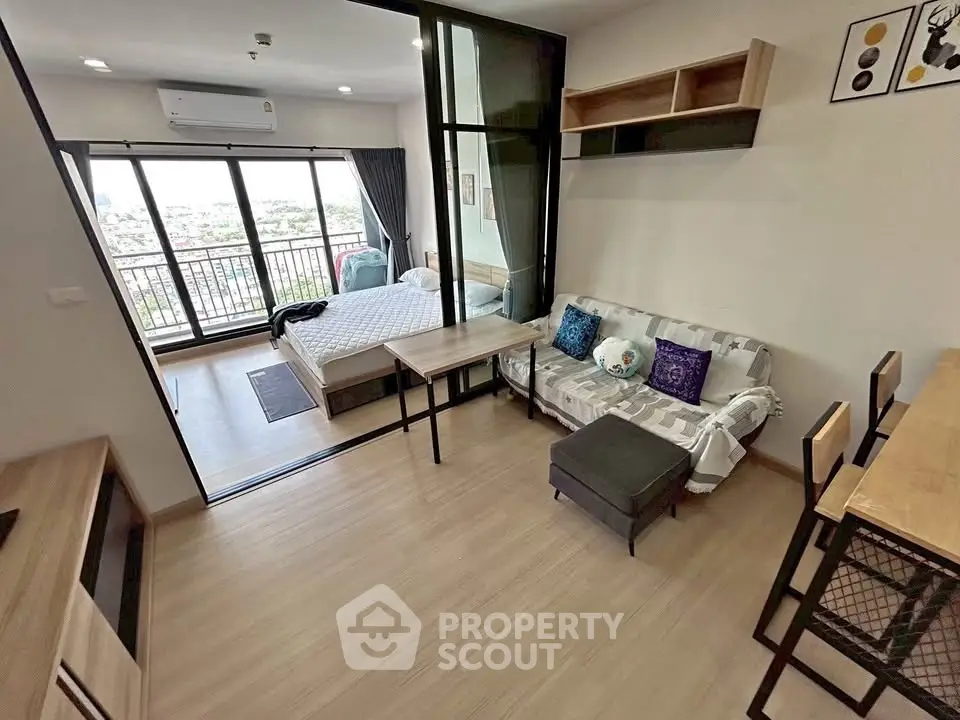 Modern studio apartment with open layout and balcony view