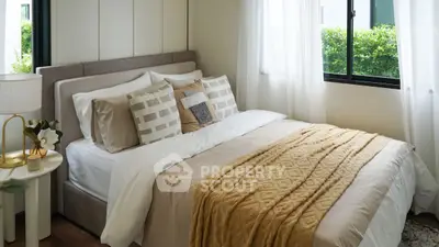 Cozy and stylish bedroom with natural light and elegant decor