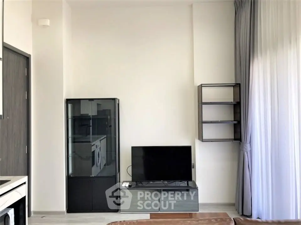 Modern living room with sleek TV setup and stylish shelving