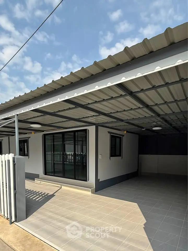 Modern home exterior with covered carport and sleek design, perfect for contemporary living.