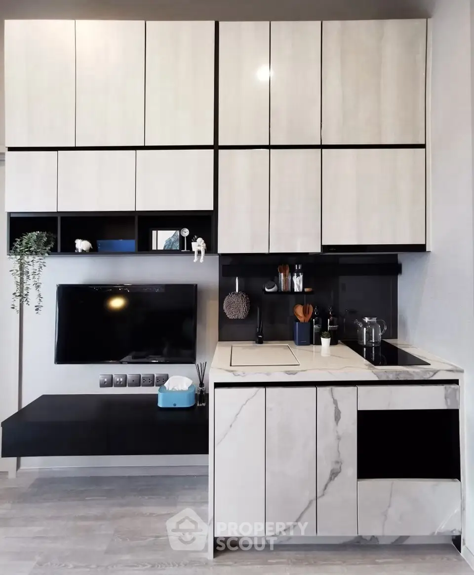 Modern kitchen with sleek cabinetry and marble countertops