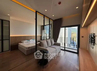 Modern studio apartment with sleek design, featuring a cozy living area and a stunning city view from the balcony.
