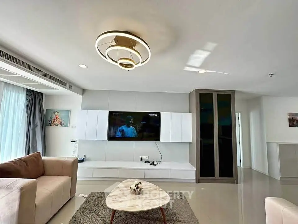 Modern living room with stylish furniture and elegant lighting