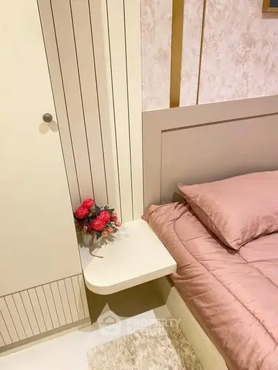 Cozy bedroom with elegant decor and soft pink bedding