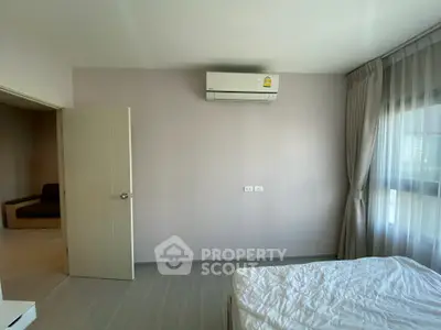 Modern bedroom with air conditioning and natural light