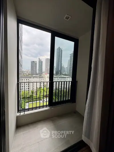 Chic urban balcony with stunning cityscape views, perfect for modern living.