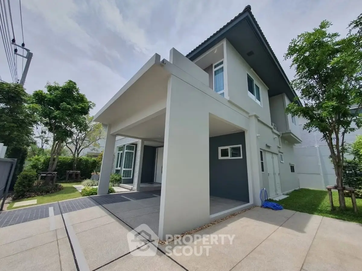 Modern two-story house with sleek design and spacious driveway