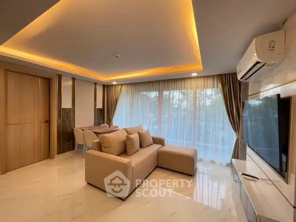 Spacious modern living room with elegant lighting and large windows