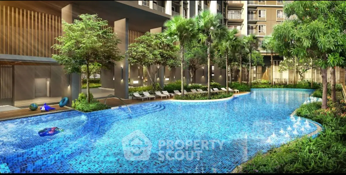 Luxurious residential pool area with lush greenery and modern design.