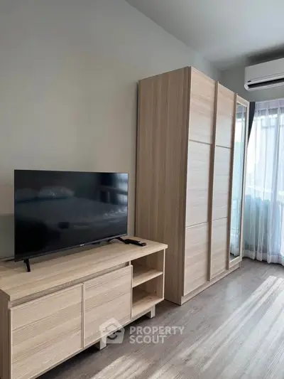 Modern bedroom with sleek wooden furniture and natural light