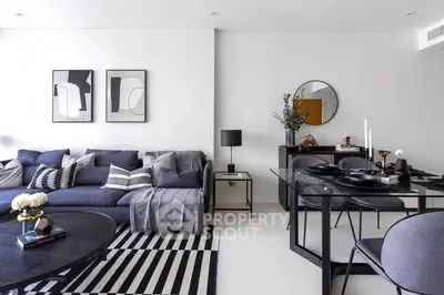 Modern living room with stylish decor and sleek furniture, perfect for contemporary lifestyle.
