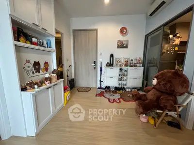 Charming entryway with playful decor and plush bear in cozy apartment