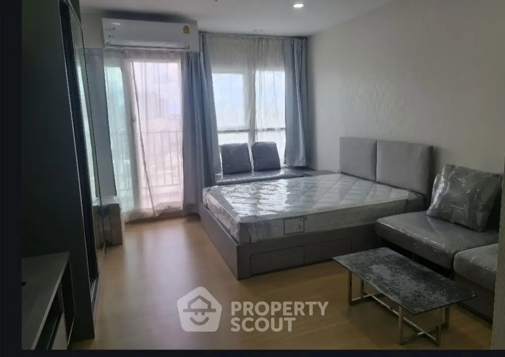 Modern living room with large windows and stylish furniture