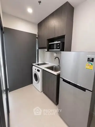Modern compact kitchen with sleek appliances and efficient layout