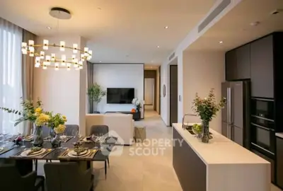 Luxurious open-plan living room and kitchen with elegant dining area and modern decor.