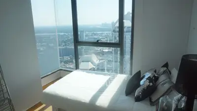 Stunning bedroom with panoramic city view and modern decor