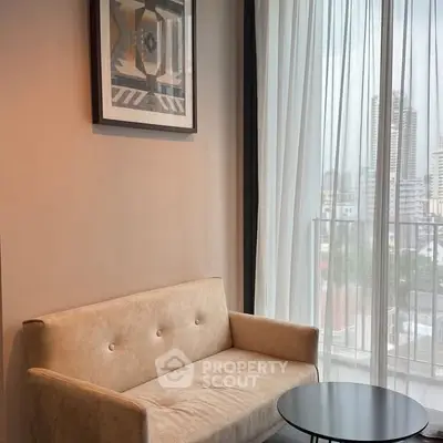 Modern living room with cozy sofa and city view from large window