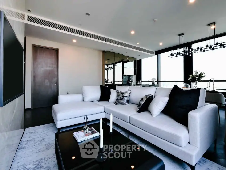 Luxurious modern living room with elegant decor and panoramic city views.