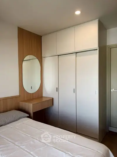 Modern bedroom with built-in wardrobe and stylish wooden accents