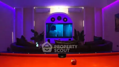 Luxurious home theater with ambient lighting and plush seating