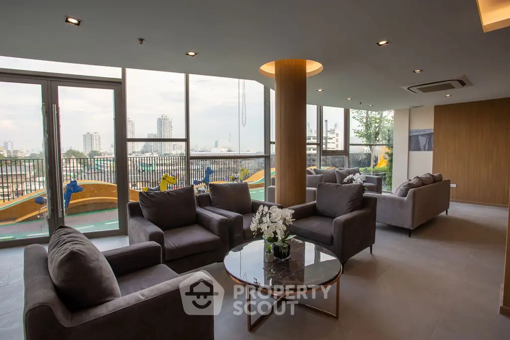 Luxurious living room with modern furniture and stunning city view, perfect for relaxation and entertainment.