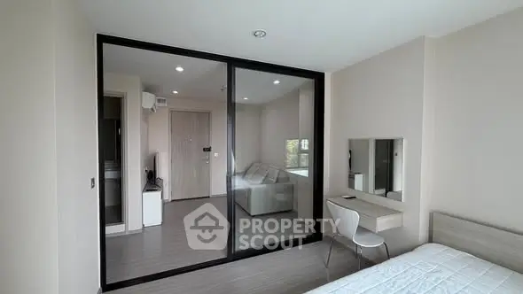 Modern bedroom with glass partition and minimalist decor