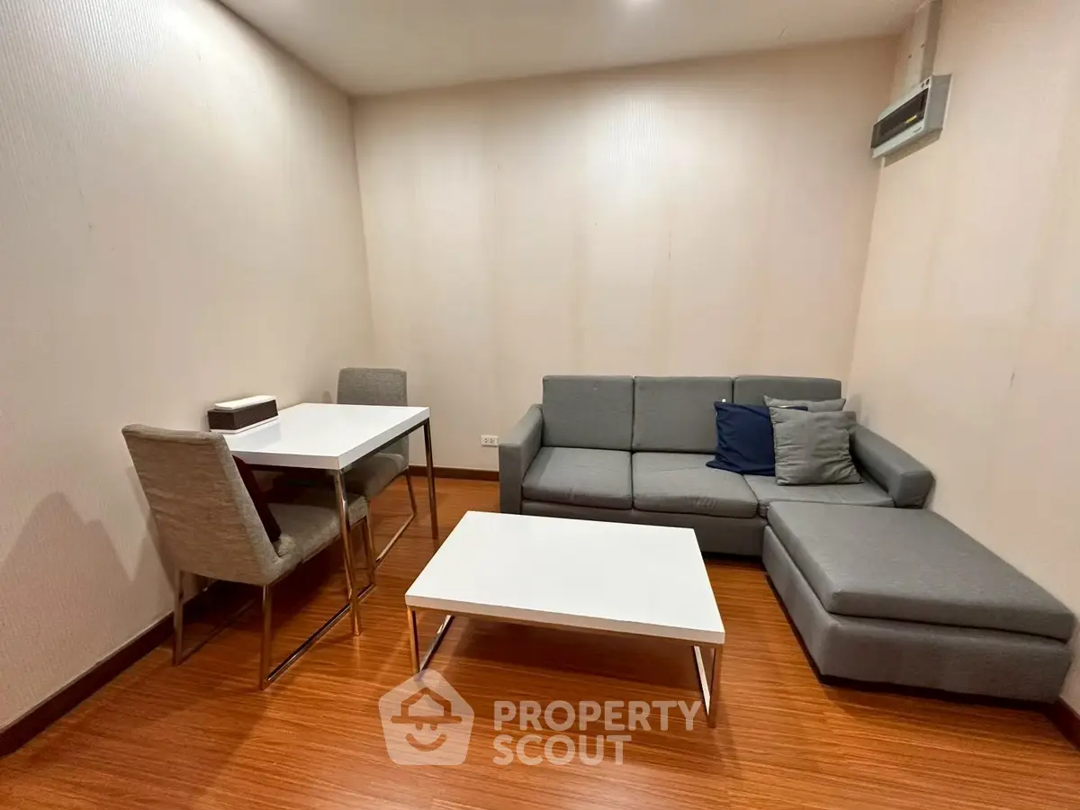 Modern living room with sleek furniture and wooden flooring