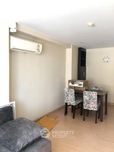 Cozy living room with dining area and air conditioning in modern apartment