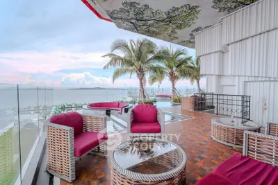 Luxurious balcony with stunning ocean view and stylish outdoor furniture
