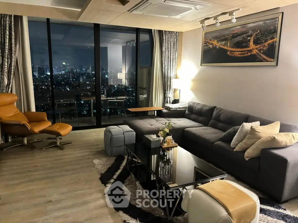 Luxurious living room with city view, modern furniture, and elegant decor in high-rise apartment.