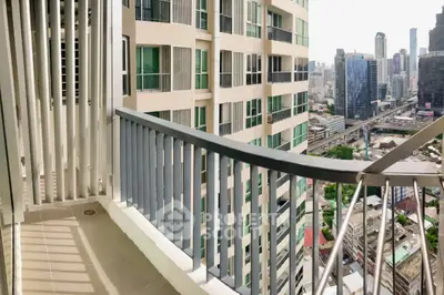Spacious balcony with stunning city view in modern high-rise building