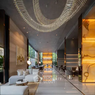 Luxurious modern living room with elegant decor and stunning lighting fixtures.
